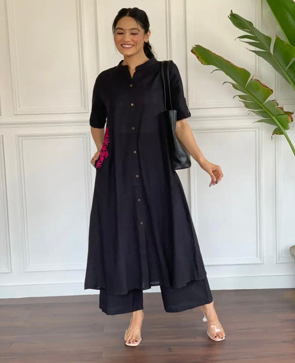 Black A-line cotton suit for women with front buttons and pink embroidered pocket detail