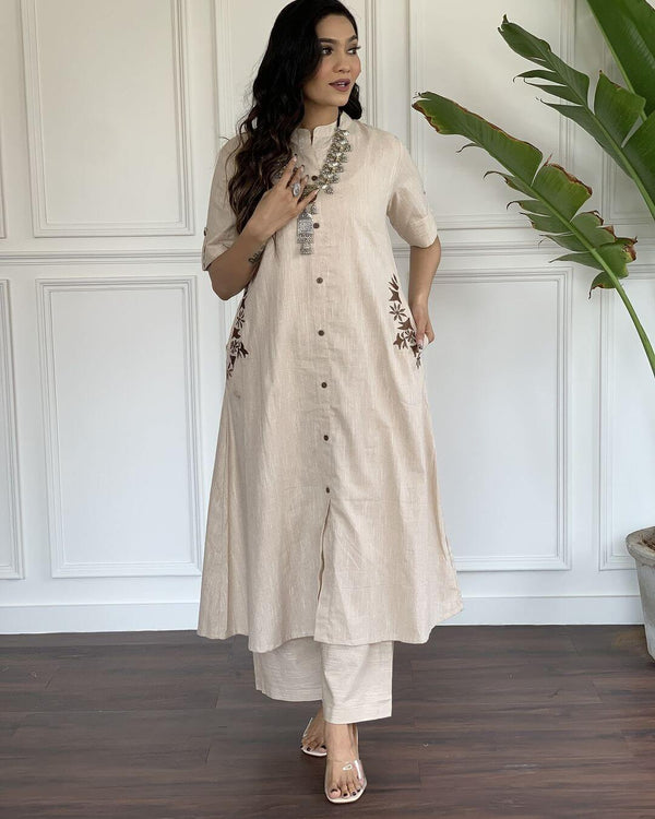 Beige A-line cotton suit for women with button-down front and floral embroidery