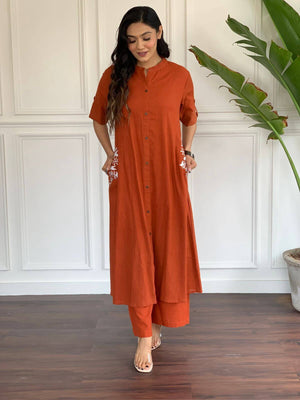 Cotton Suit A-line cotton suit for women in rust color with embroidered pockets and button-down front