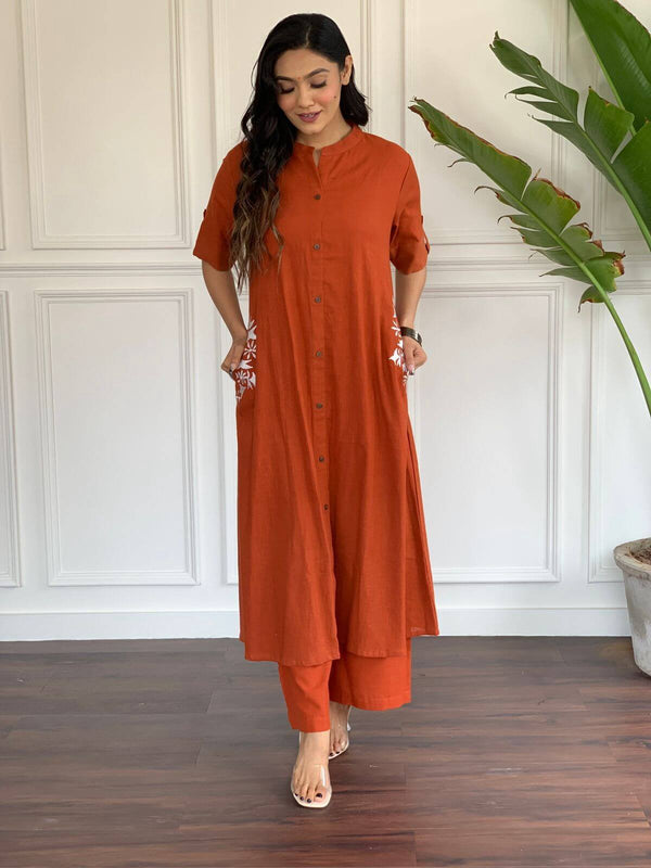 Cotton Suit A-line cotton suit for women in rust color with embroidered pockets and button-down front