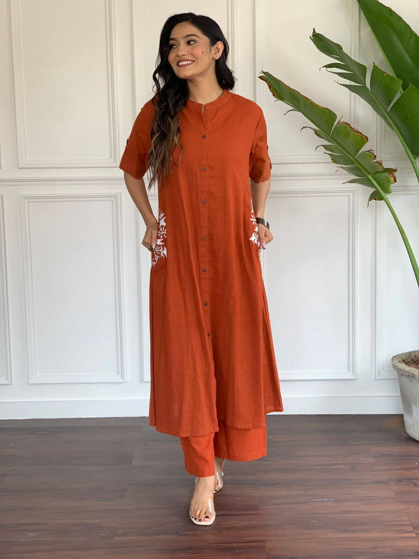 Cotton Suit A-line cotton suit for women in rust color with button-down front and embroidered pockets