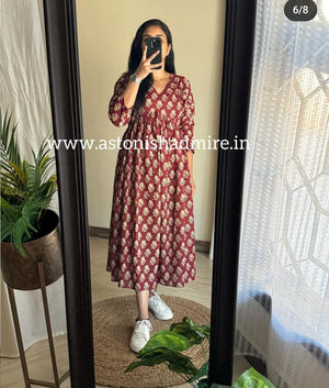 Woman wearing THREAD JAIPUR casual printed middy gown with white sneakers standing in front of a mirror