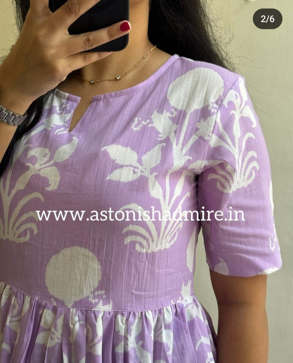 Close-up of purple print middy gown with white floral patterns on half sleeves by THREAD JAIPUR