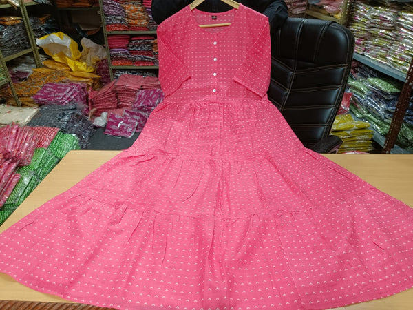 Thread Jaipur women's casual midi dress in pink fabric with white patterns displayed on wooden table