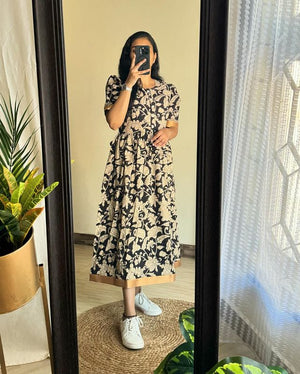 Woman wearing Azrak print summer dress by Jaipuri Pehnawa with floral pattern and short sleeves