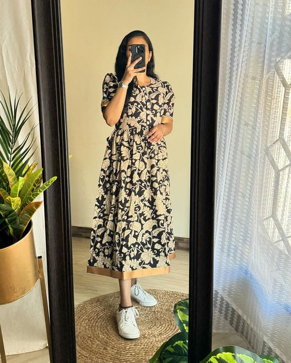 Woman wearing Azrak print summer dress by Jaipuri Pehnawa with floral pattern and short sleeves