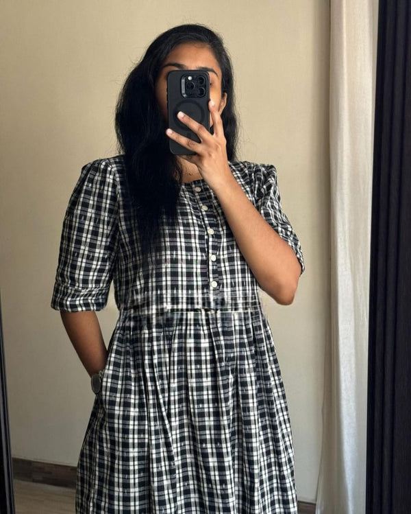  Cotton Suit black and white cotton middy gown with plaid pattern and buttoned front worn by woman