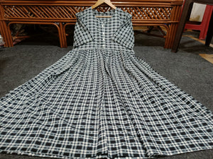  Cotton Suit black and white cotton middy gown with checkered pattern and long sleeves laid flat