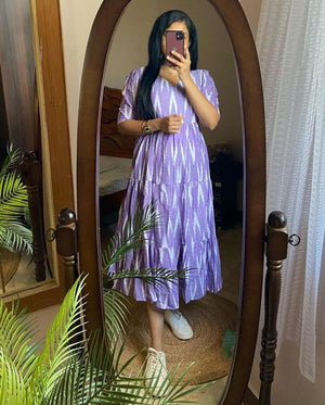  Cotton Suit blue arrow print midi dress worn by woman with long hair and white sneakers