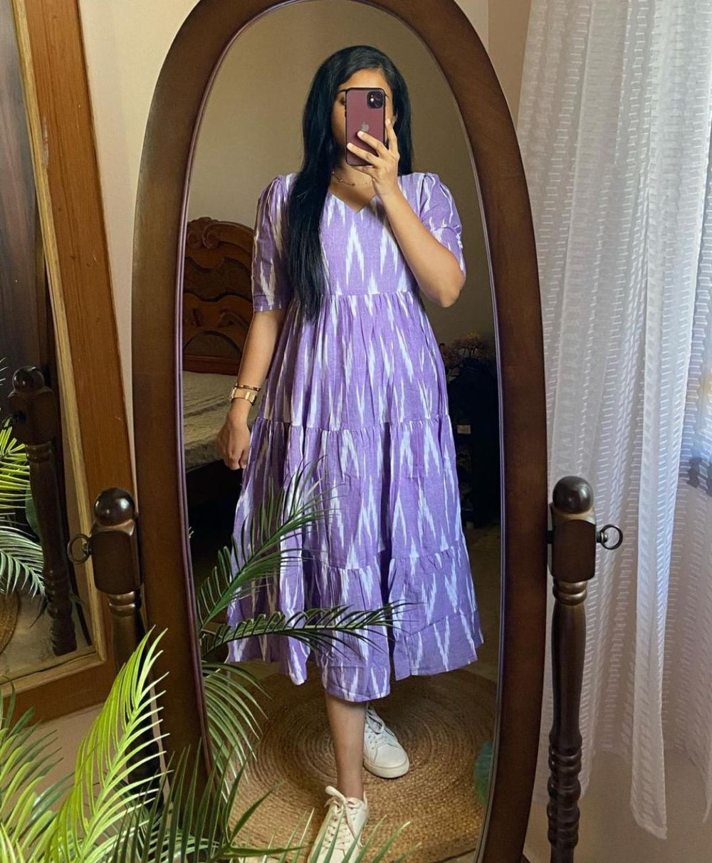  Cotton Suit blue arrow print midi dress gown worn by woman taking mirror selfie indoors