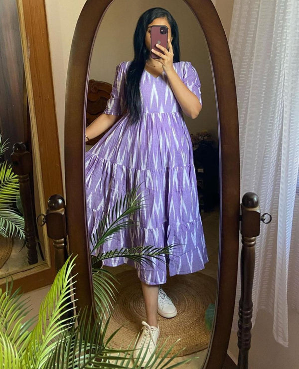  Cotton Suit blue arrow print midi dress gown with puff sleeves and tiered skirt worn by woman