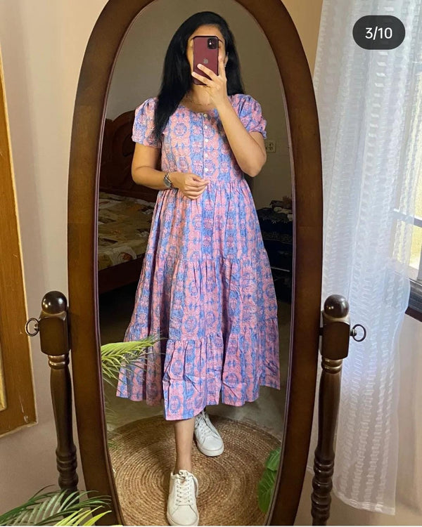 Sugamdha blue cotton midi dress gown with puff sleeves and floral print worn by woman
