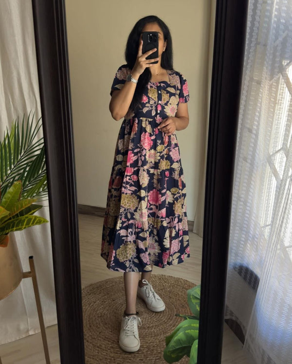  Cotton Suit blue floral cotton midi dress worn by woman in mirror with pink and beige flowers