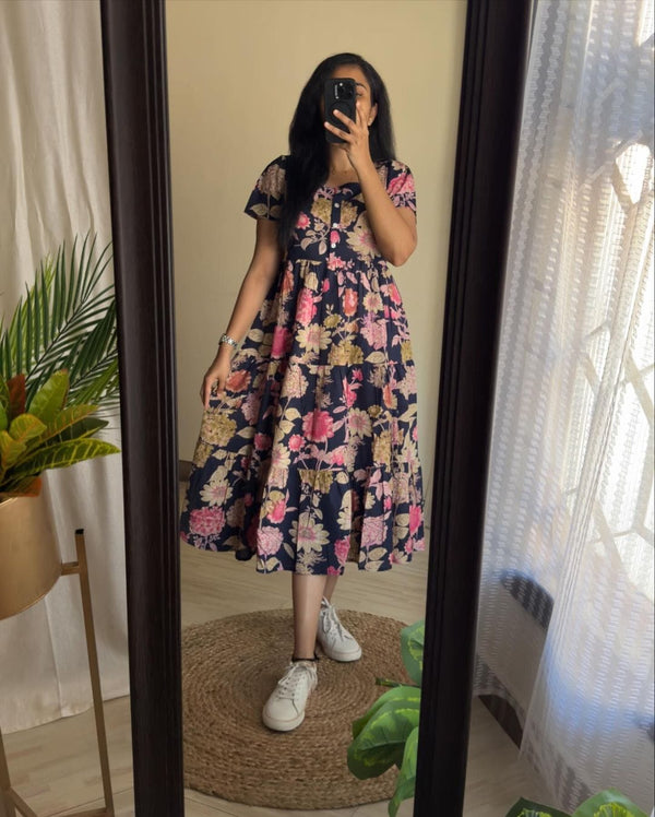  Cotton Suit blue floral cotton midi dress worn by woman standing in front of mirror with white sneakers