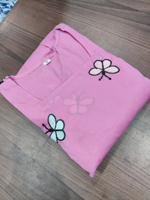 Cotton Suit pink gown with delicate butterfly embroidery gown design folded on wooden floor