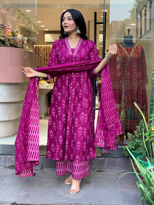 Cotton Suit cotton embroidered kurta pant dupatta set in magenta with traditional patterns worn by a model