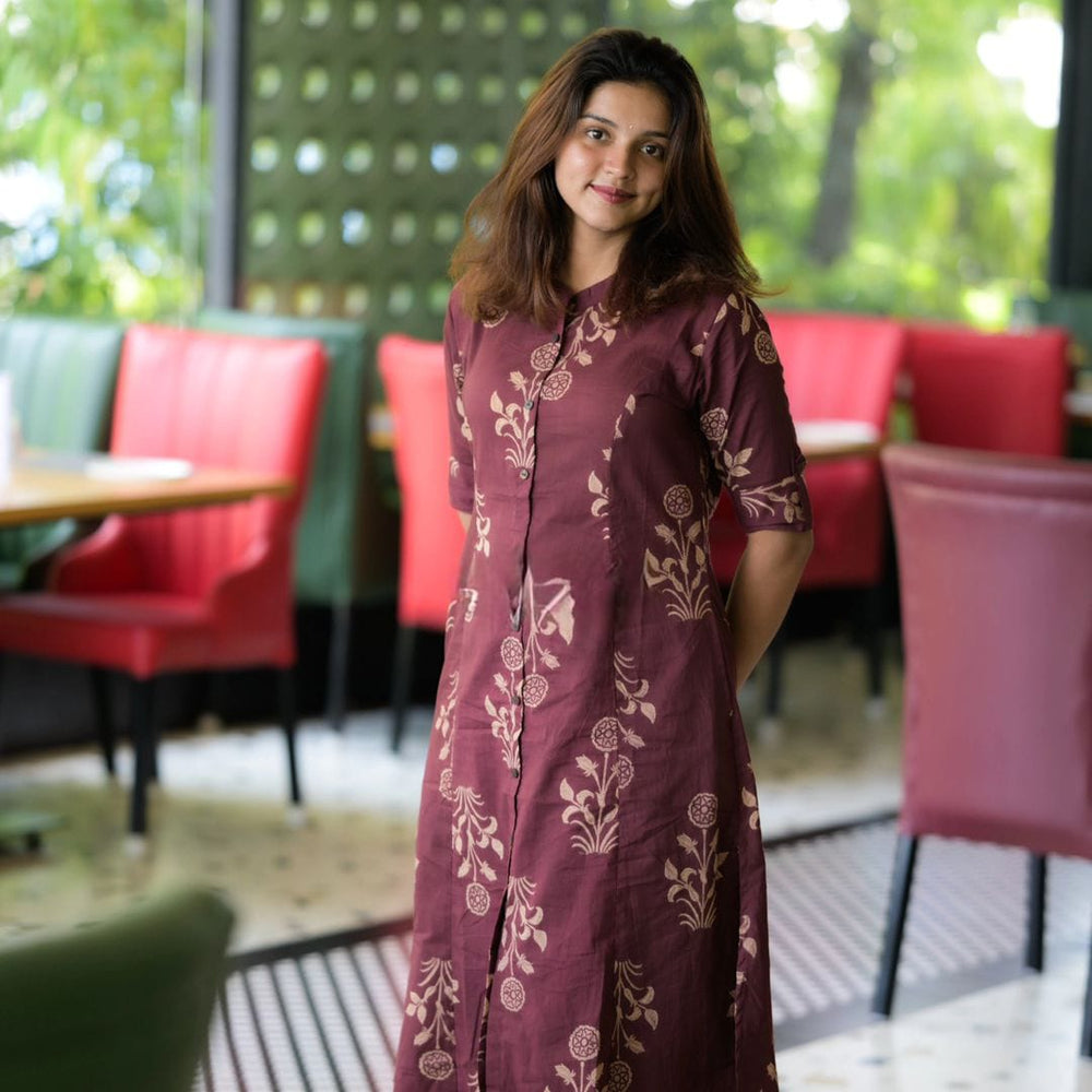 Shringaar cotton floral co-ord set for women in maroon with beige floral prints worn by a smiling woman