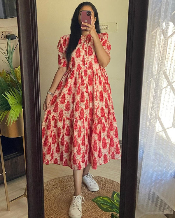 Woman wearing a red and white cotton regular wear midi dress by Cotton Suit with short sleeves and white sneakers