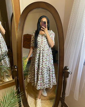 Elephant print cotton dress by Cotton Suit worn by woman in front of full-length mirror
