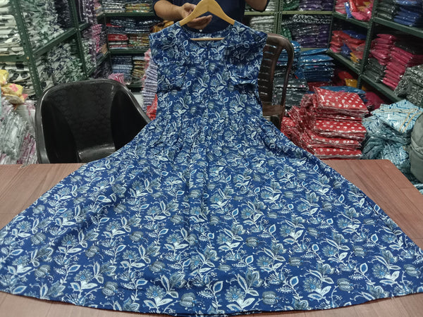 Sugamdha floral midi dress for women in blue with white leaf pattern displayed on table