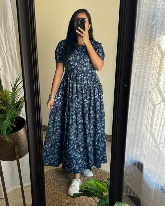 Sugamdha floral midi dress for women in navy blue with puff sleeves and white floral print