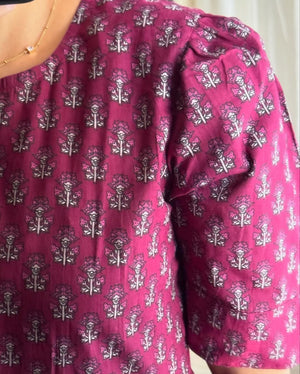 Cottonsuit floral printed cotton maxi dress close-up showing pink fabric with intricate floral patterns