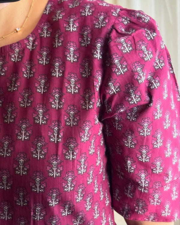 Cottonsuit floral printed cotton maxi dress close-up showing pink fabric with intricate floral patterns
