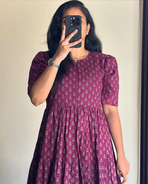 Woman wearing maroon floral printed cotton maxi dress with short sleeves by Cottonsuit