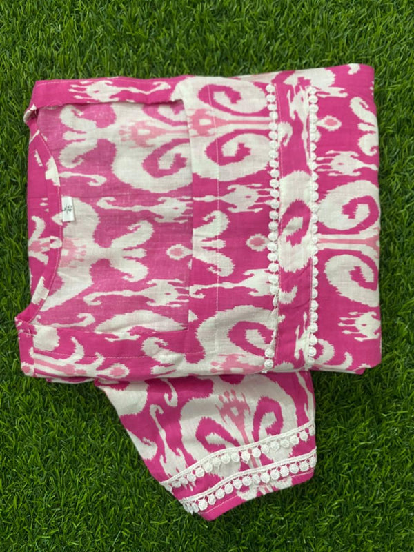Cotton Suit women's casual cotton midi dress in pink and white folded on green grass