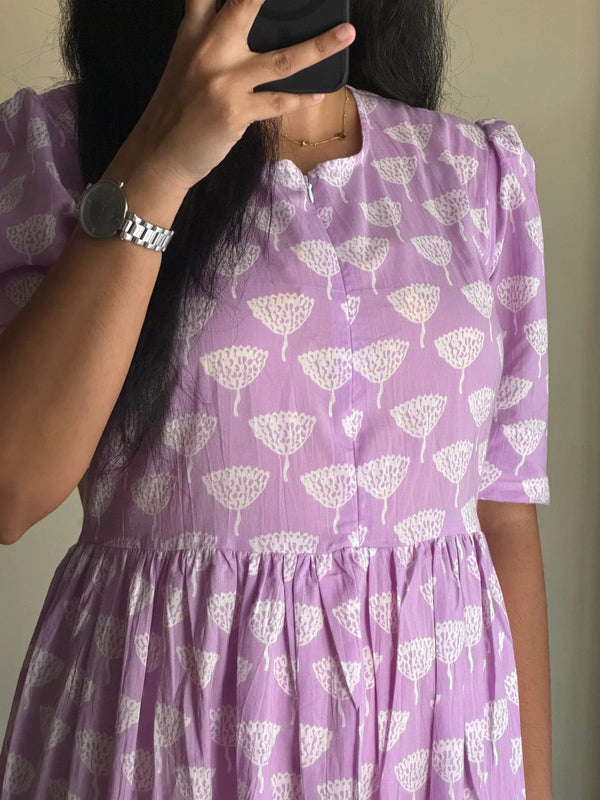 Lavender full flair middy gown for women with white floral print and half sleeves by Jaipuri pehnawa