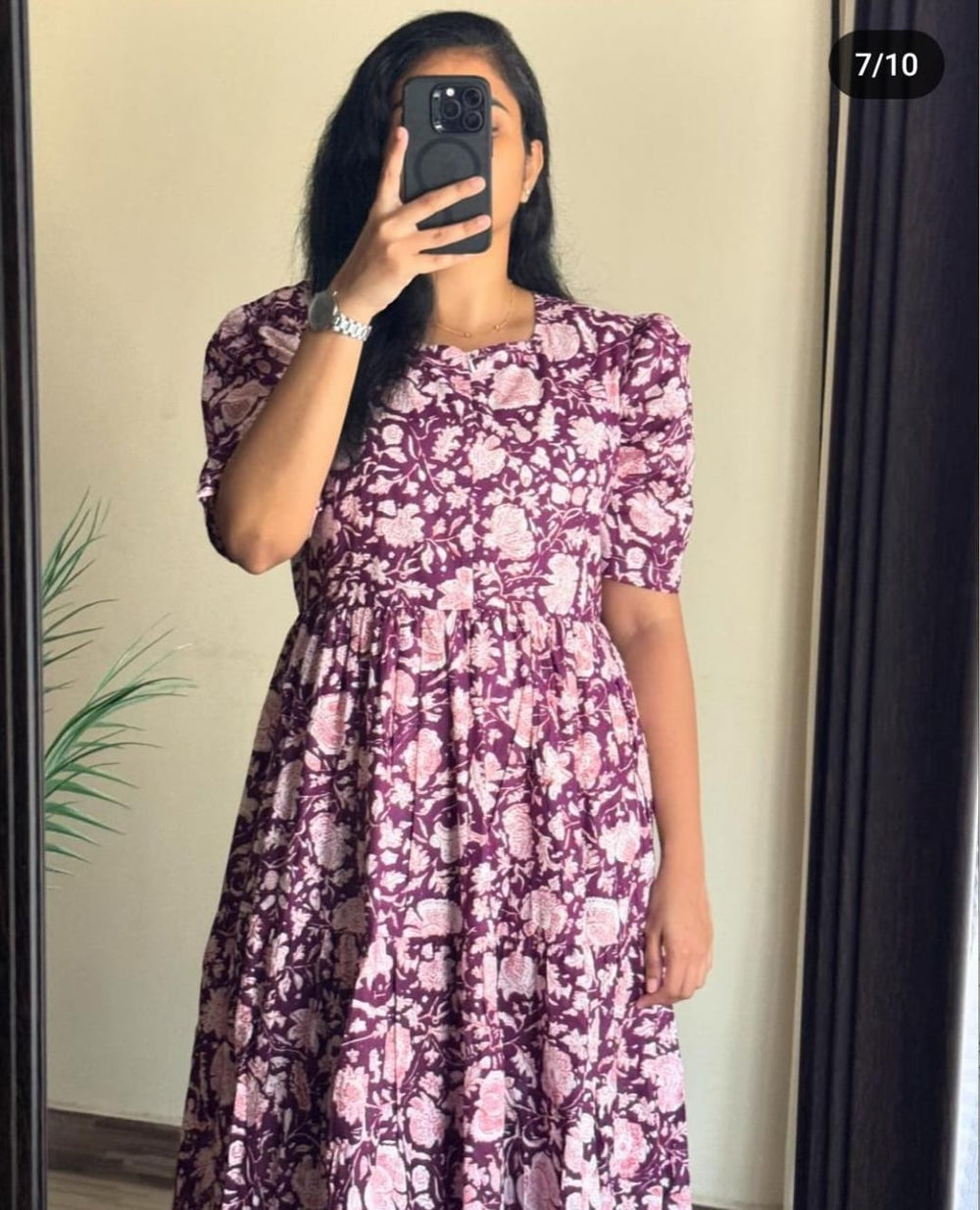Woman wearing a floral Ikkat print gown in shades of purple and pink by  Cotton Suit
