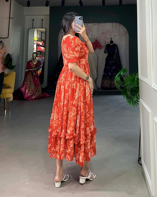 Jaipuri pehnawa pink flowy maternity gown worn by woman taking mirror selfie in boutique