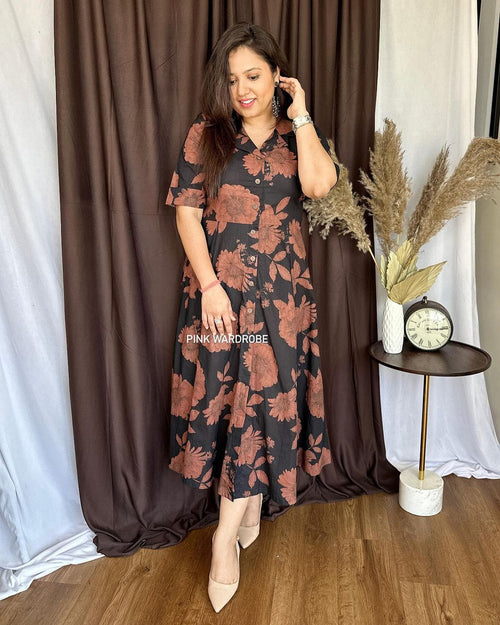 Cottonsuit casual a-line cotton dress in black with brown floral print worn by a woman