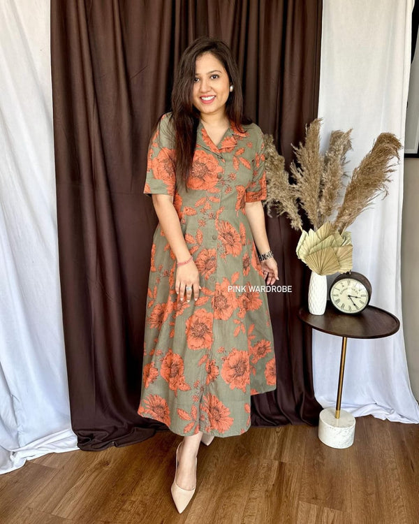 Cottonsuit casual a-line cotton dress with orange floral print worn by woman indoors