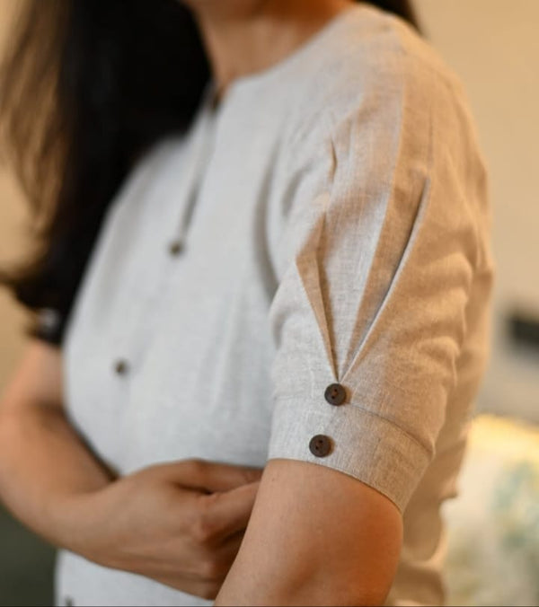 Close-up of women's khadi cotton outfit sleeve with button details by Jaipuri Pehnawa
