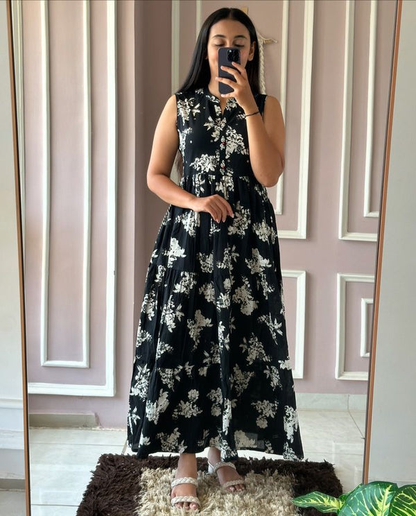  Cotton Suit sleeveless floral cotton dress with black base and white flower pattern worn by woman