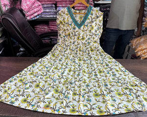 Cotton Suit women's cotton anarkali dress with floral print and blue neckline detail laid flat on table