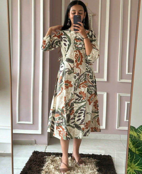 Cotton Suit casual cotton midi gown with floral leaf print worn by woman taking a mirror selfie