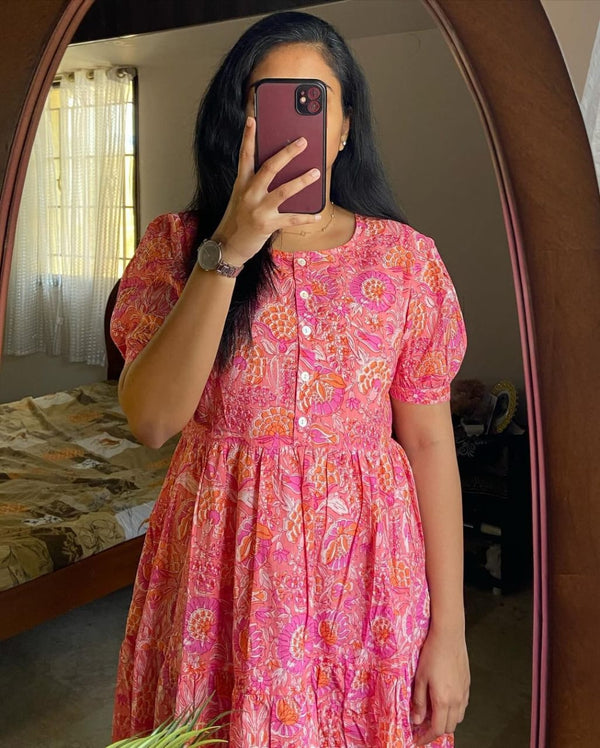 Woman wearing Cotton Suit lehriya print casual dress for women in pink with floral patterns
