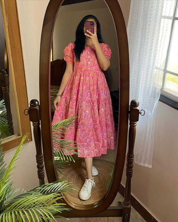 Woman wearing Cotton Suit lehriya print casual dress for women in pink standing in front of a mirror