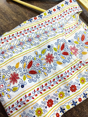 Cotton Suit multicolor printed cotton dress with floral and geometric patterns on white fabric