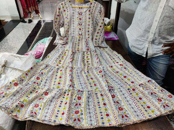 Cotton Suit multicolor printed cotton dress gown with floral and geometric patterns laid out on a table