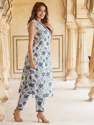 Woman wearing Cottonsuit viscose rayon kurta pant set with blue floral print and sleeveless kurta