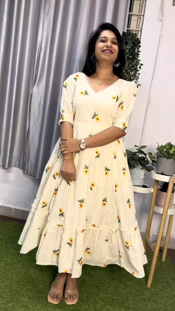  Cotton Suit white cotton embroidered midi dress with yellow floral patterns and ruffled hem worn by woman