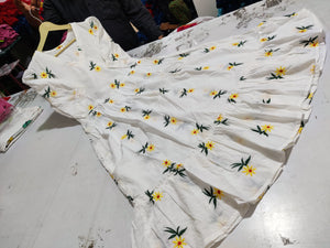  Cotton Suit white cotton embroidered midi dress with yellow floral patterns spread out on table