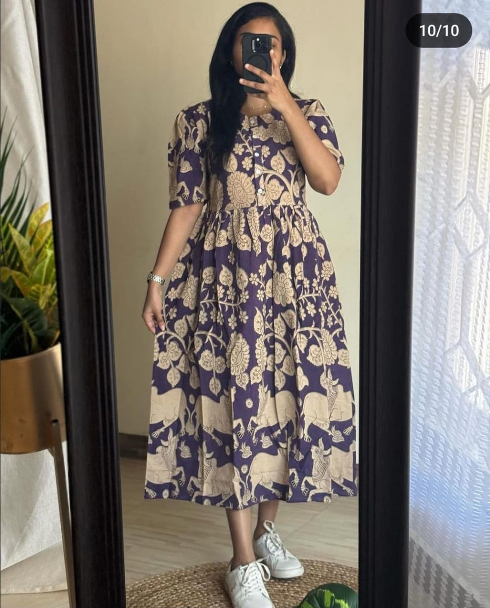 Women wearing THREAD JAIPUR women's beige summer dress with floral and animal print, styled with white sneakers