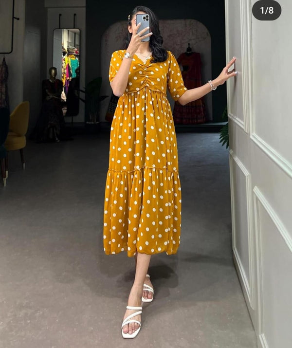 Woman wearing yellow women's casual polka dot gown with short sleeves and white sandals