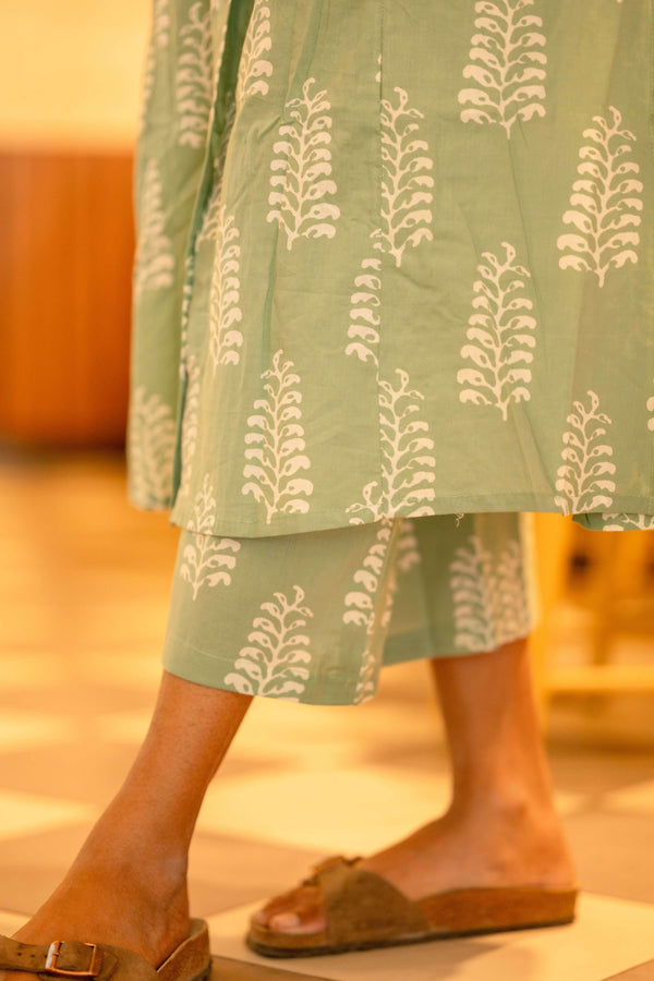 Close-up of women's summer cotton co-ord suit in green with white print from Cottonsuit
