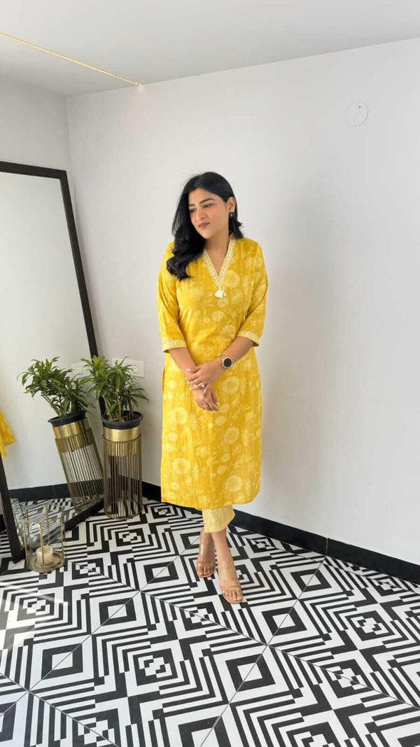 Yellow and pink office wear kurta by Cotton Suit styled with light-colored pants and minimal accessories