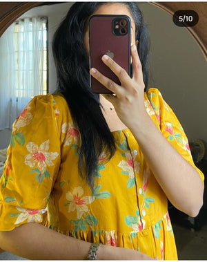 Yellow casual kurti with sleeves featuring floral print and button details from Cottonsuit
